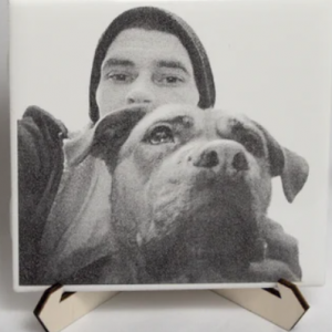 Man and Black Dog etched on a tile with laser cut stand.